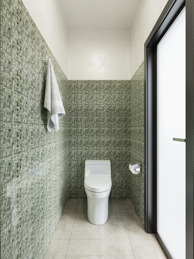 bathroom featuring toilet and tile patterned flooring