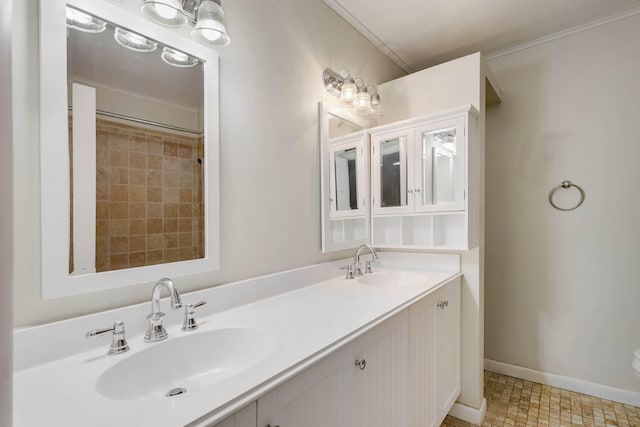 bathroom with ornamental molding and vanity