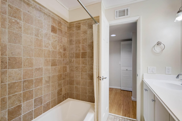 bathroom with vanity, hardwood / wood-style floors, and shower / tub combo with curtain