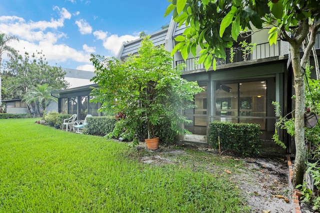 view of yard featuring a sunroom