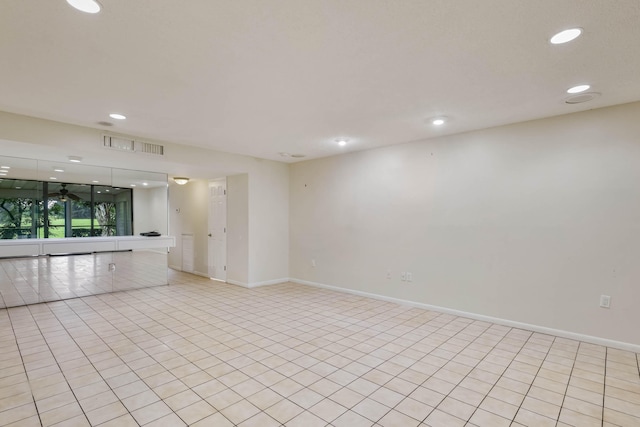 unfurnished room featuring light tile patterned floors