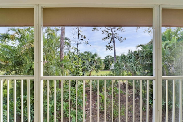 unfurnished sunroom featuring a balcony