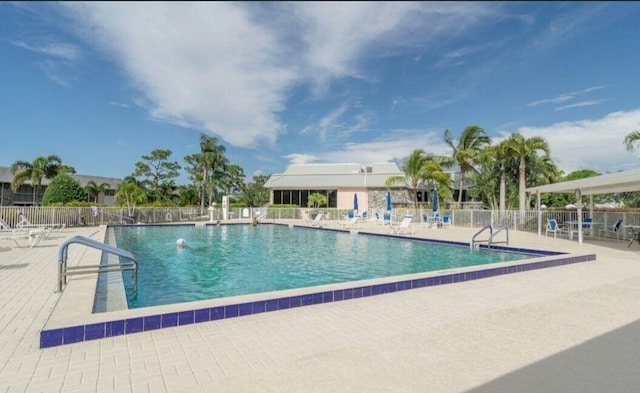 view of swimming pool featuring a patio area