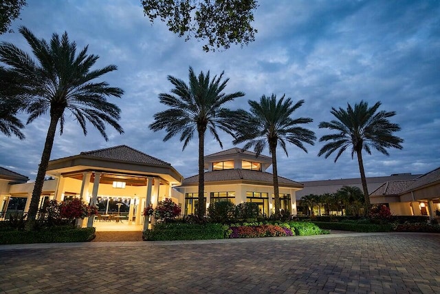 view of outdoor building at dusk