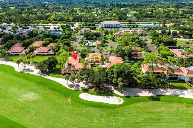 drone / aerial view with a residential view and golf course view