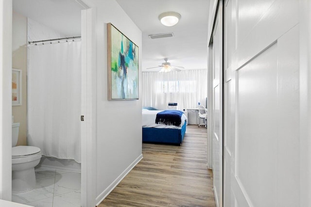 hallway featuring hardwood / wood-style flooring