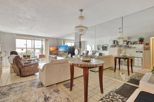 living room with light tile patterned floors, a textured ceiling, and a chandelier