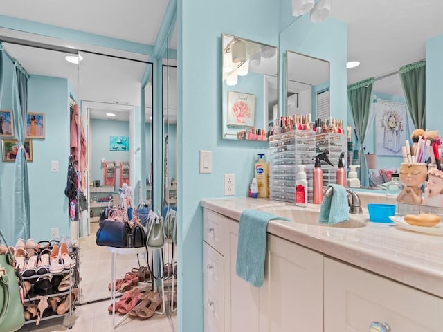 bathroom with vanity and tile patterned flooring