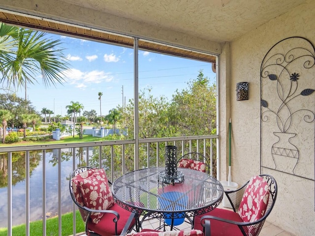 balcony featuring a water view