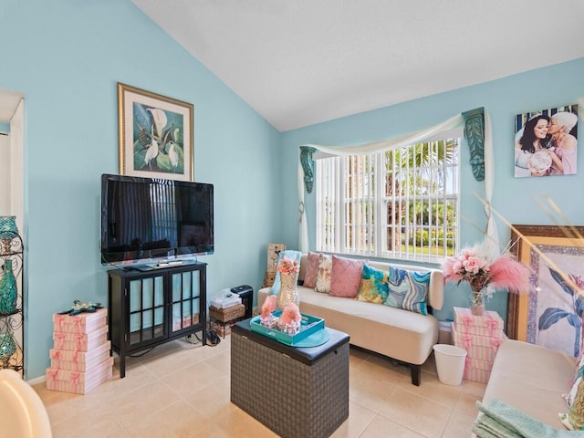 living room featuring light tile patterned flooring and vaulted ceiling