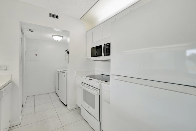 kitchen with sink, white dishwasher, and white cabinets