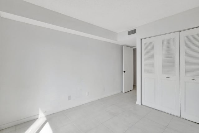 bedroom featuring light tile patterned flooring