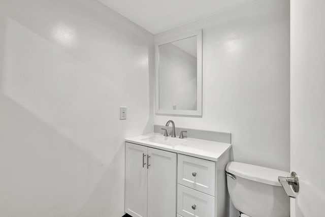 bathroom featuring toilet and a shower with shower door