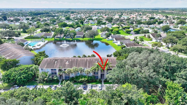 drone / aerial view with a water view