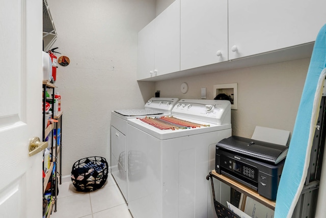 8228 Brindisi Ln, Boynton Beach, FL 33472 - laundry area with washer and dryer, cabinet space, and tile patterned flooring