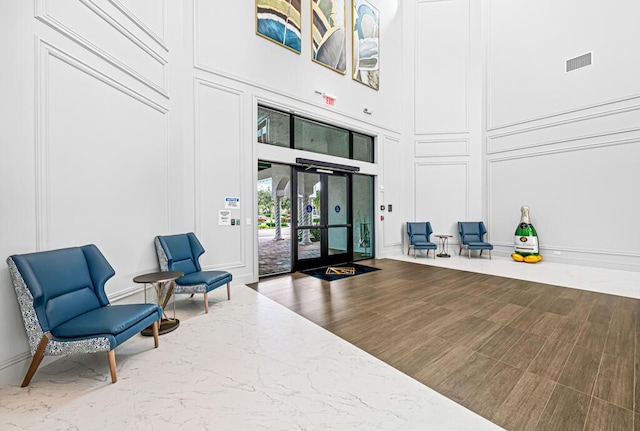 8228 Brindisi Ln, Boynton Beach, FL 33472 - common area featuring a decorative wall and a high ceiling