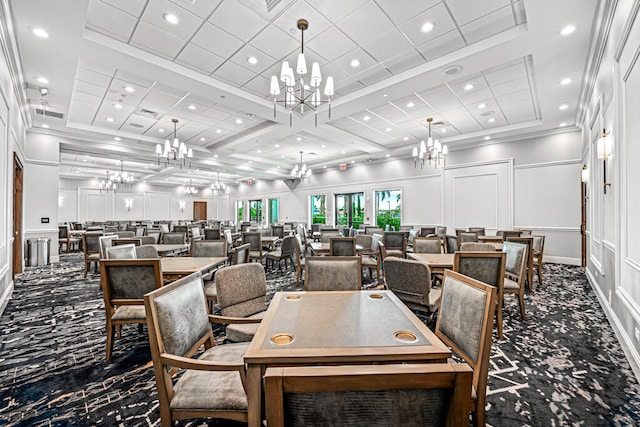 dining space with ornamental molding and coffered ceiling