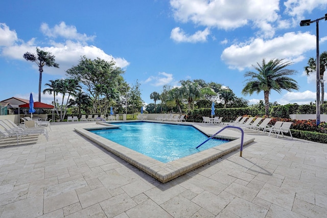 view of swimming pool with a patio