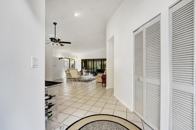 hallway featuring light tile patterned flooring