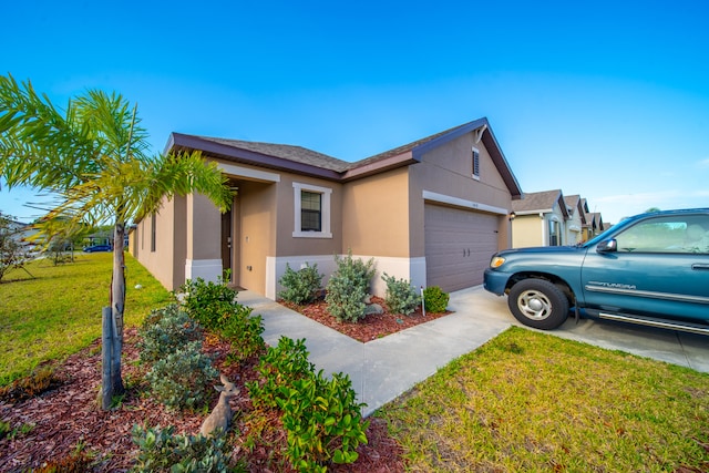 view of front facade featuring a front yard and a garage