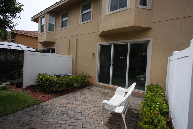 rear view of property featuring a patio