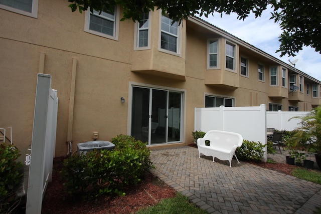 5946 Monterra Club Dr, Lake Worth, FL 33463 - exterior space with a patio area, fence, and stucco siding