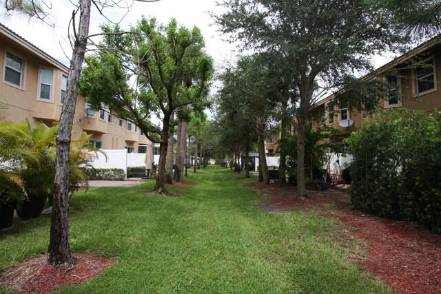 view of home's community featuring a yard