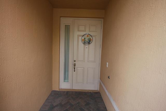 5946 Monterra Club Dr, Lake Worth, FL 33463 - doorway to property featuring stucco siding
