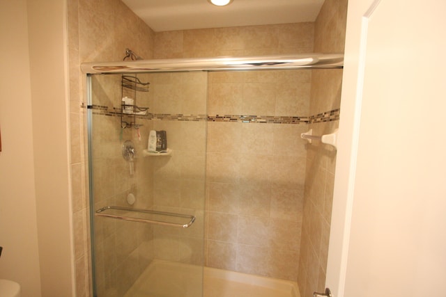 bathroom featuring an enclosed shower