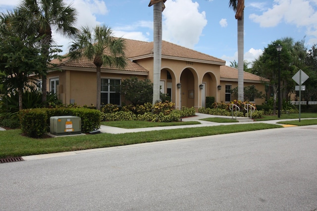5946 Monterra Club Dr, Lake Worth, FL 33463 - mediterranean / spanish home featuring a tile roof and stucco siding