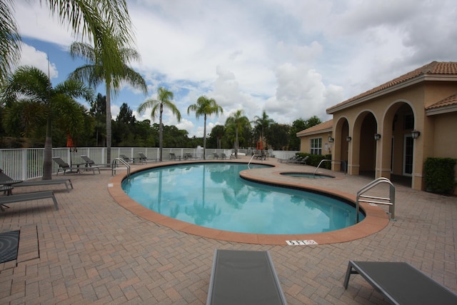 5946 Monterra Club Dr, Lake Worth, FL 33463 - pool featuring a community hot tub, a patio, and fence
