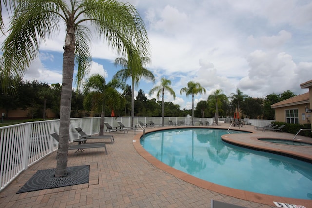 5946 Monterra Club Dr, Lake Worth, FL 33463 - pool featuring a patio, fence, and a hot tub