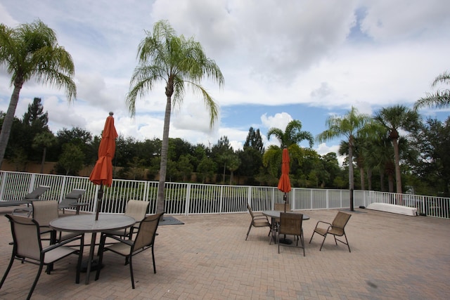 5946 Monterra Club Dr, Lake Worth, FL 33463 - view of patio / terrace featuring outdoor dining area and fence