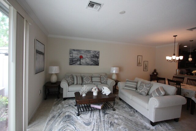 carpeted living room with a chandelier and crown molding