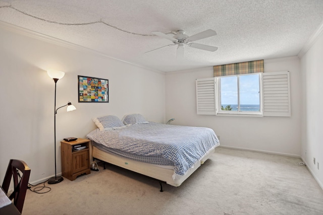 carpeted bedroom with a textured ceiling and ceiling fan