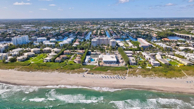 aerial view featuring a view of the beach and a water view