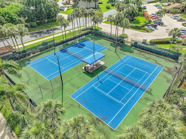 view of tennis court with fence