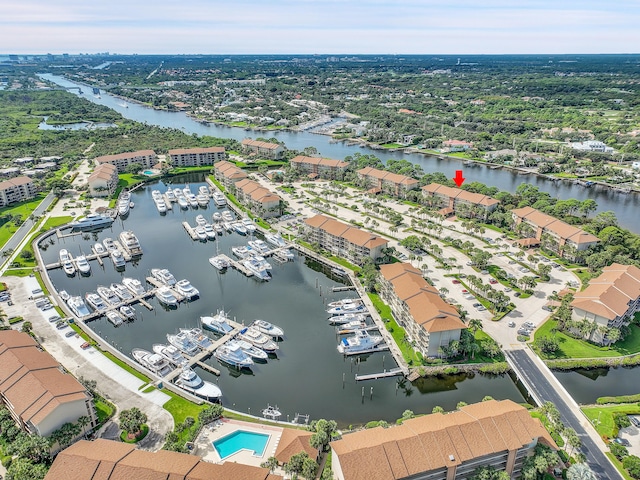 bird's eye view of numerous boat docks and a nearby body of water