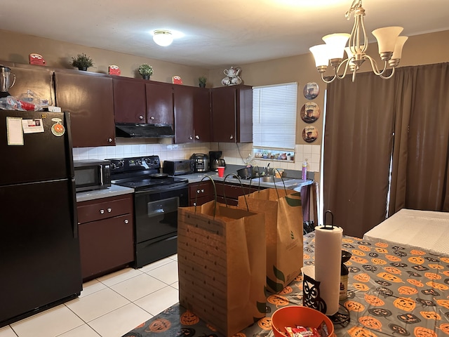 kitchen with black appliances, dark brown cabinets, hanging light fixtures, decorative backsplash, and an inviting chandelier