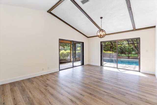 interior space featuring beam ceiling, light wood-type flooring, and high vaulted ceiling