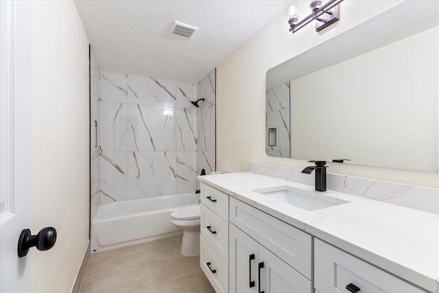 full bathroom with vanity, a textured ceiling, toilet, and tiled shower / bath combo