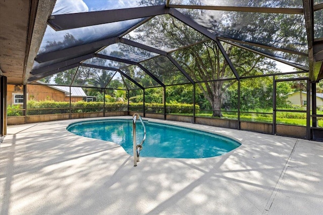 view of pool featuring a lanai and a patio