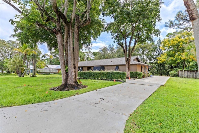 ranch-style house with a front yard