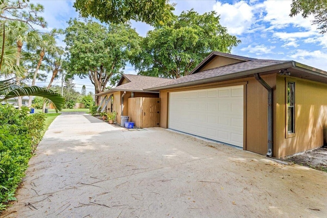 view of property exterior featuring a garage