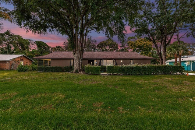 view of front of property with a yard