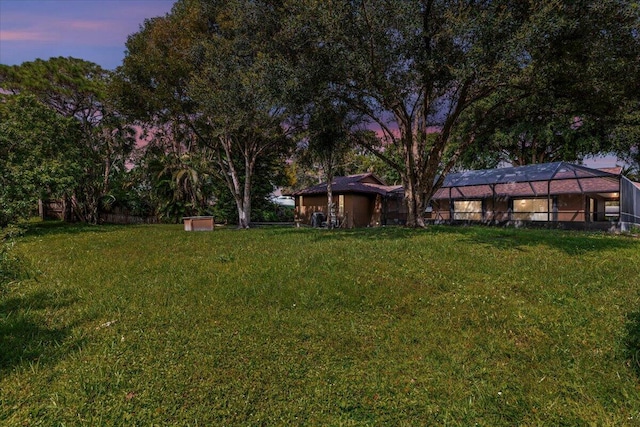 yard at dusk with glass enclosure