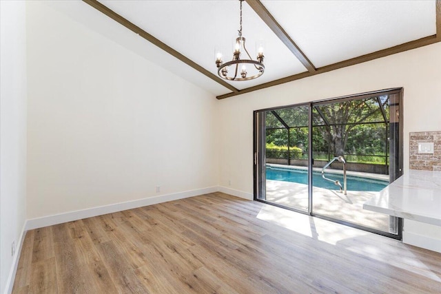 unfurnished room with lofted ceiling with beams and light hardwood / wood-style floors