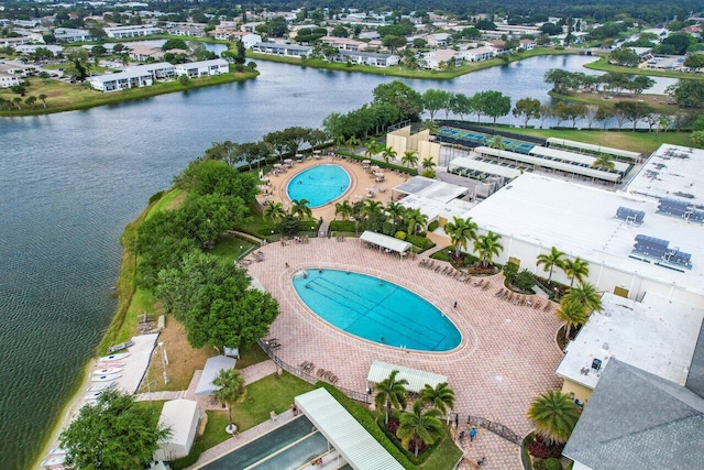 birds eye view of property featuring a water view