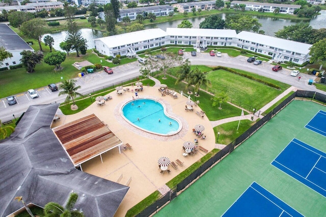 birds eye view of property featuring a water view