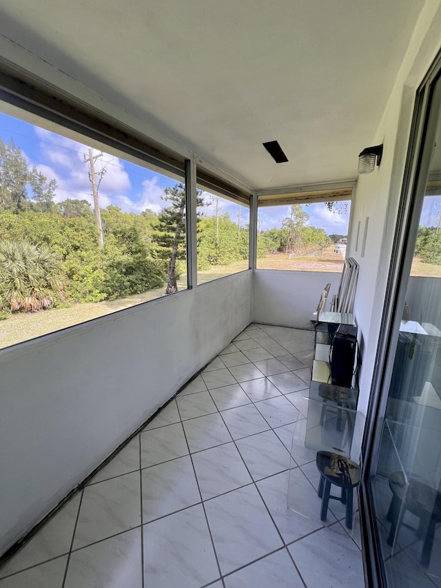 unfurnished sunroom with a wealth of natural light